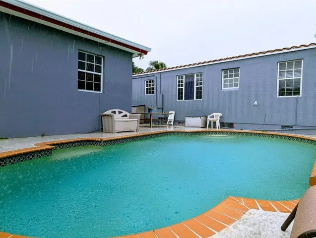 a backyard of a house with seating space