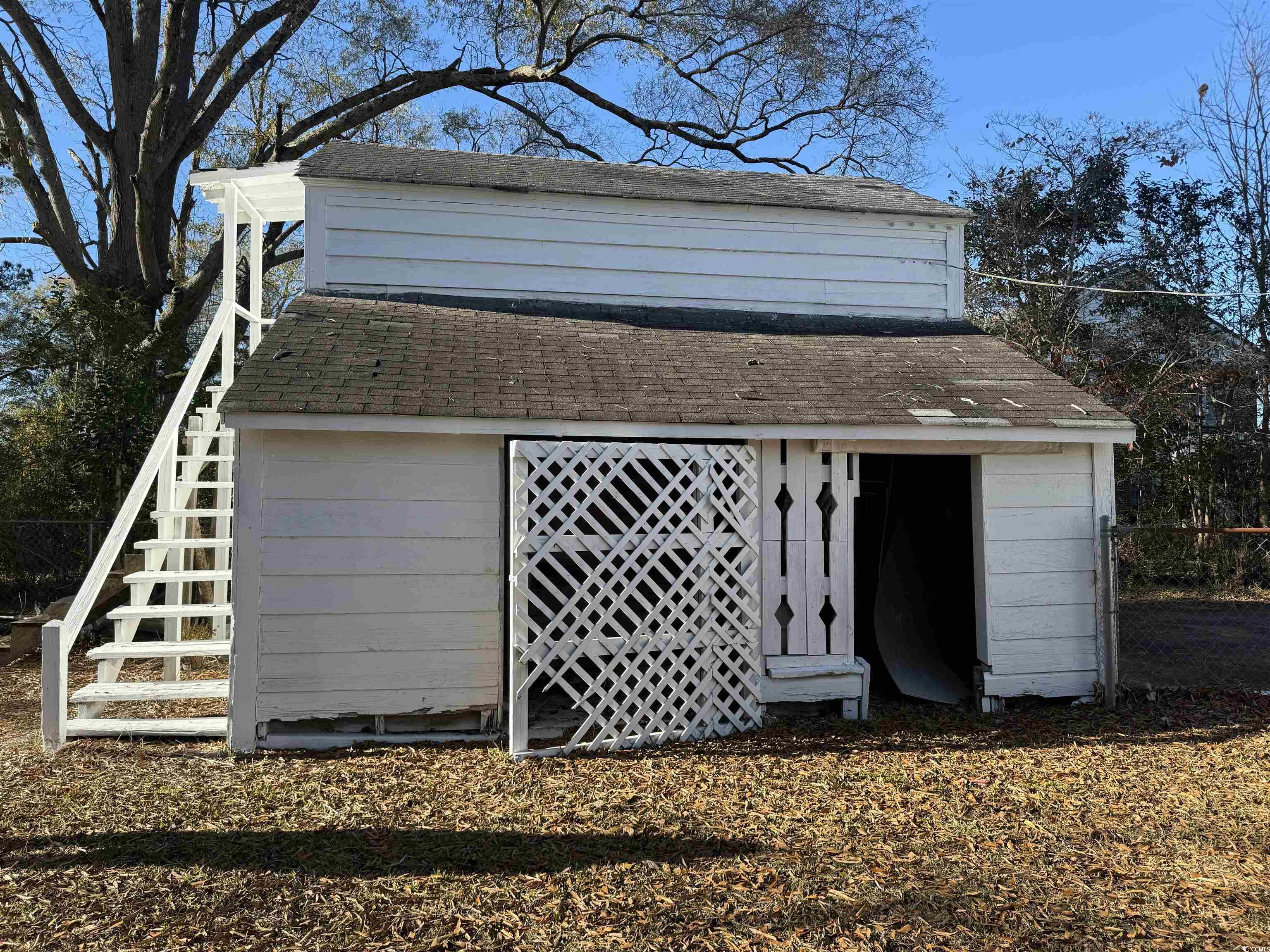 305 East Bamberg Street Latta, SC 29565 - Photo 8 of 13 View of outbuilding with stairway