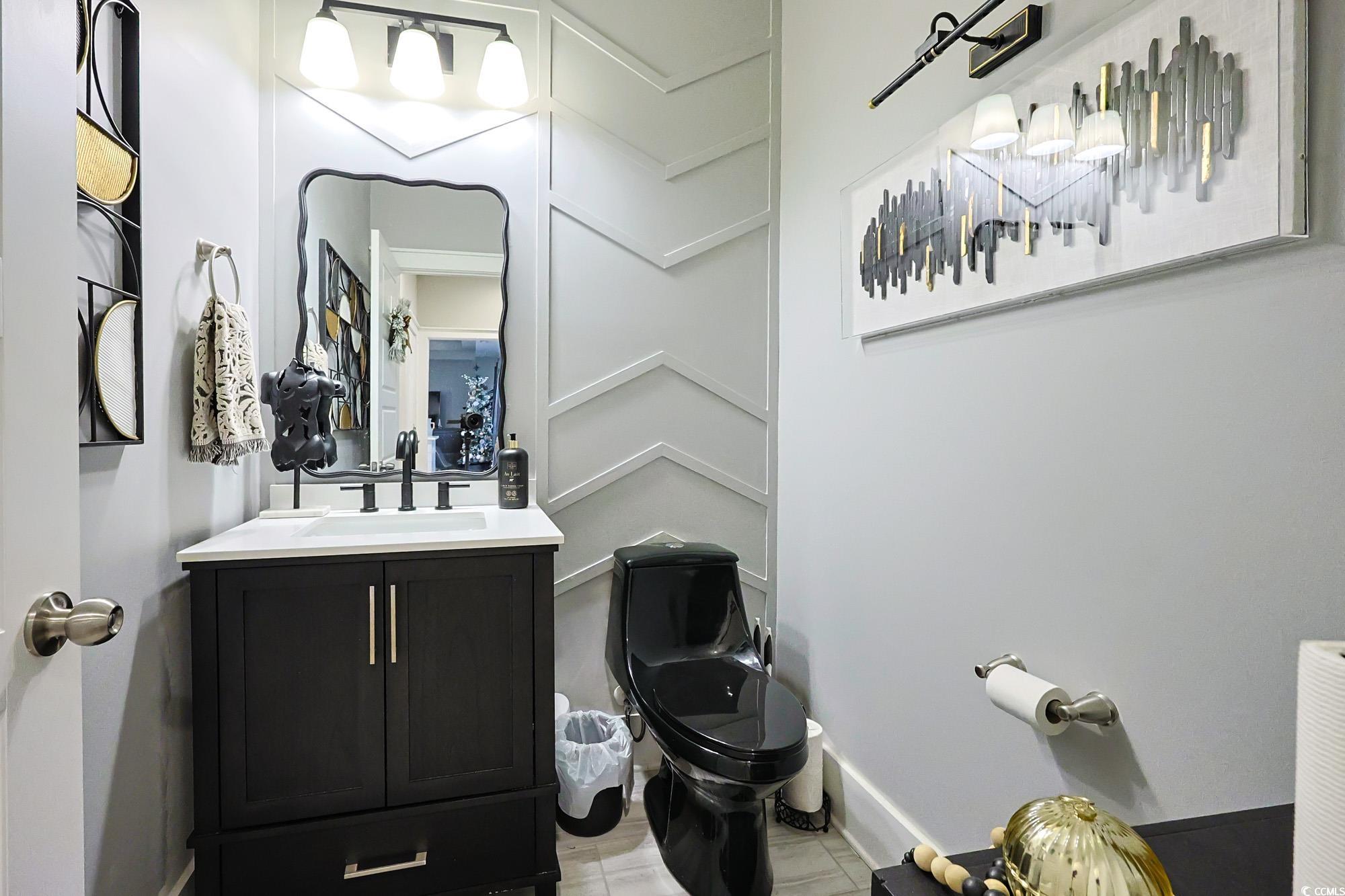 669 Pacific Commons Drive Surfside Beach, SC 29575 - Photo 25 of 36 Bathroom featuring vanity and light tile patterned floors
