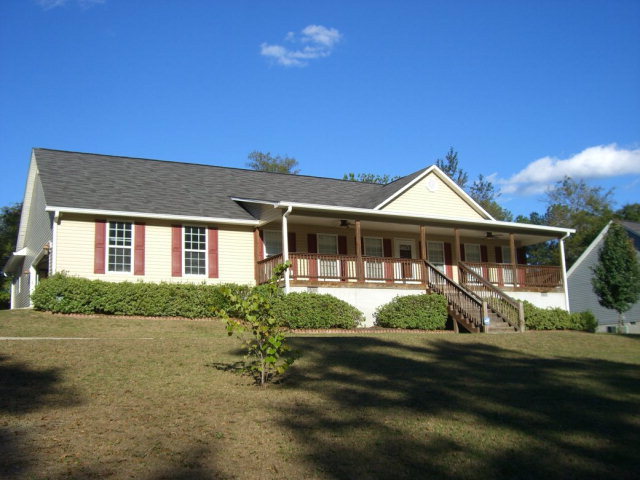 142 Whitaker Road Macon, GA 31211 - Photo 1 of 11 a front view of a house with garden