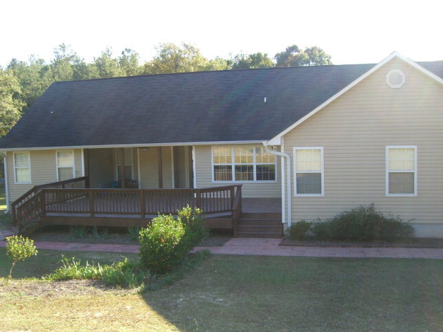 142 Whitaker Road Macon, GA 31211 - Photo 11 of 11 a front view of a house with garden