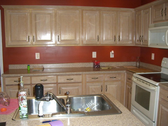 142 Whitaker Road Macon, GA 31211 - Photo 5 of 11 a kitchen with white cabinets and sink