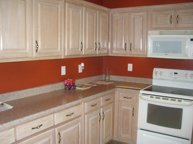 142 Whitaker Road Macon, GA 31211 - Photo 6 of 11 a kitchen with white cabinets and white appliances