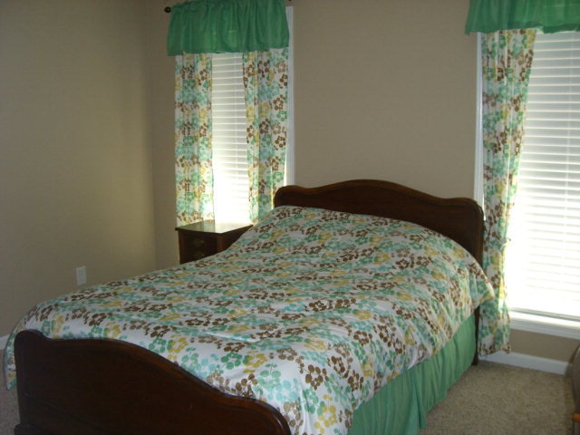 142 Whitaker Road Macon, GA 31211 - Photo 10 of 11 a bedroom with a bed and a window