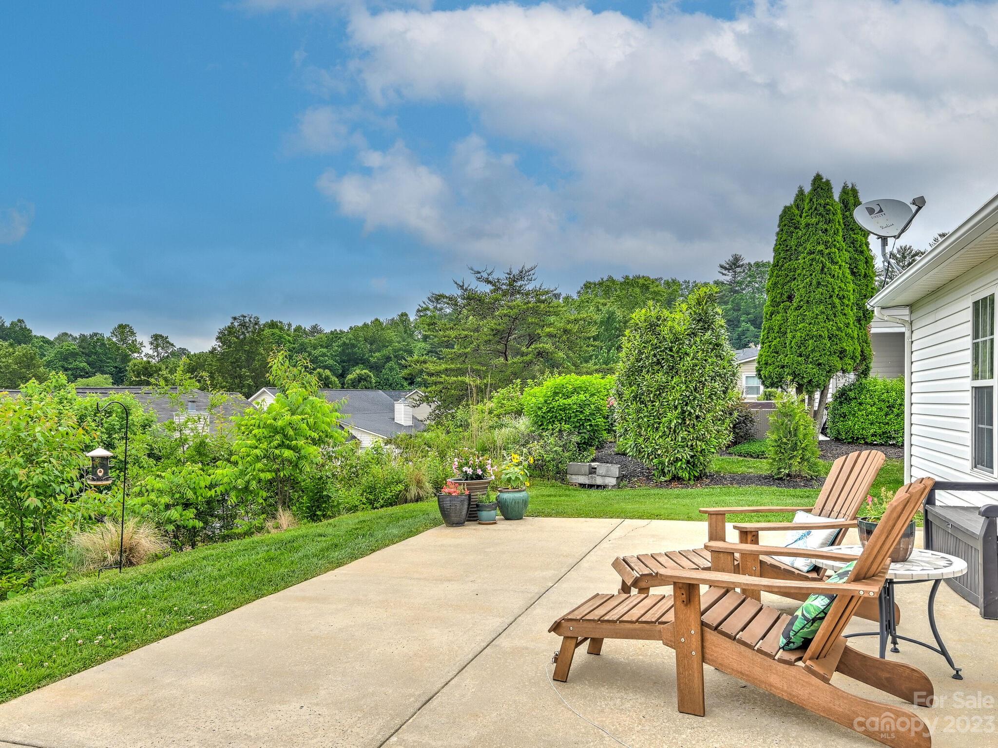 29 Stonehollow Road Fletcher, NC 28732 - Photo 11 of 21 a view of a yard with furniture and a garden