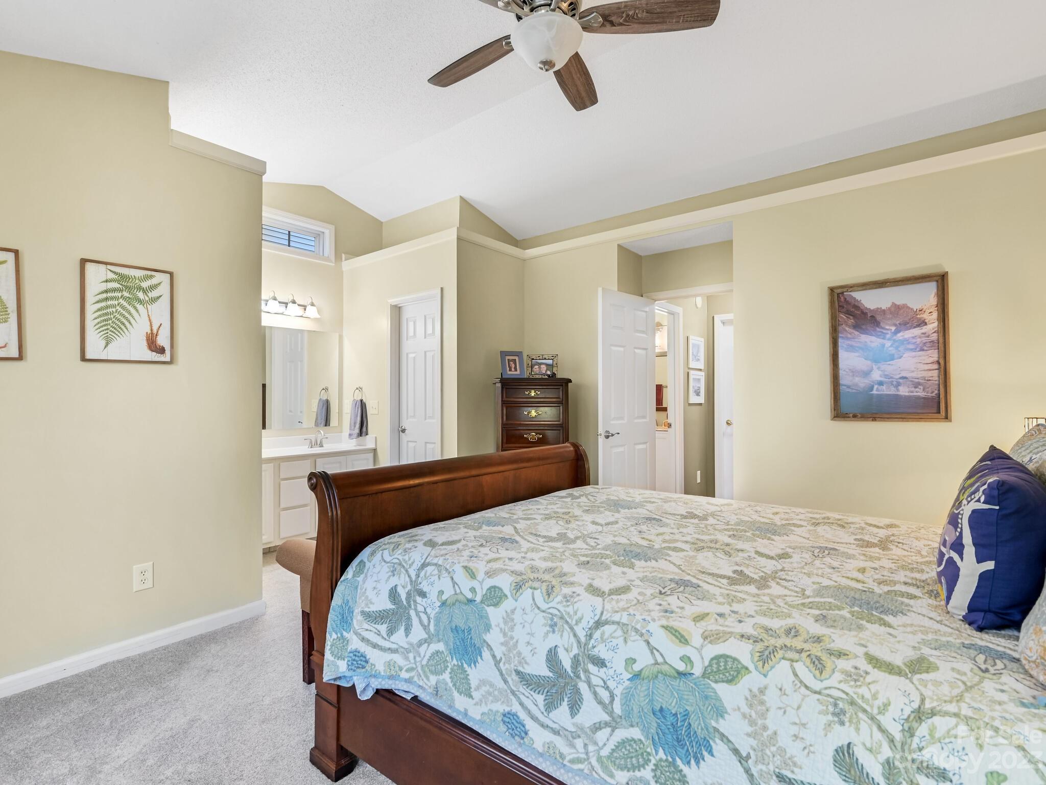 29 Stonehollow Road Fletcher, NC 28732 - Photo 15 of 21 a bedroom with a bed and painting on the wall