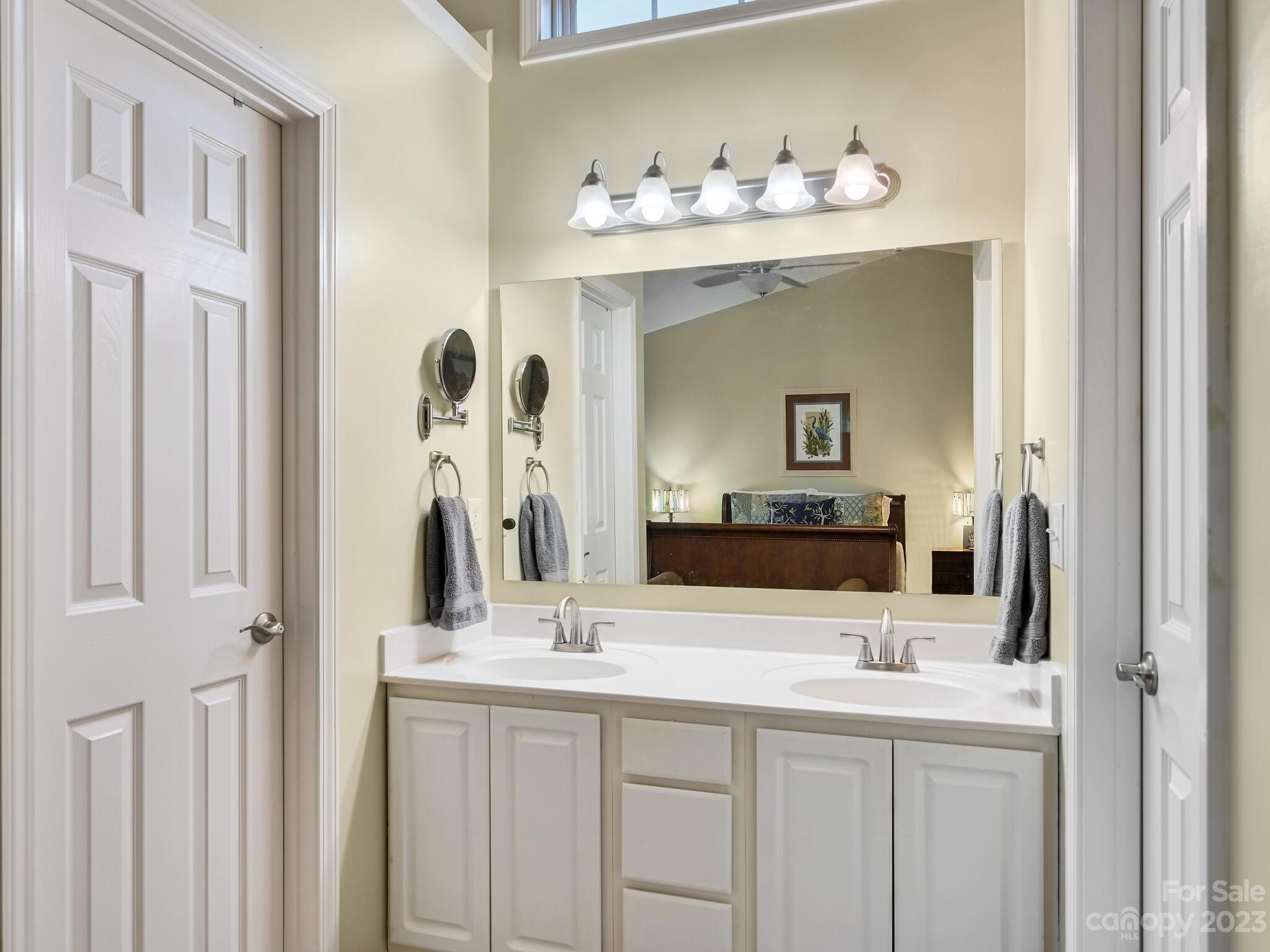 29 Stonehollow Road Fletcher, NC 28732 - Photo 16 of 21 a bathroom with a sink vanity and a mirror