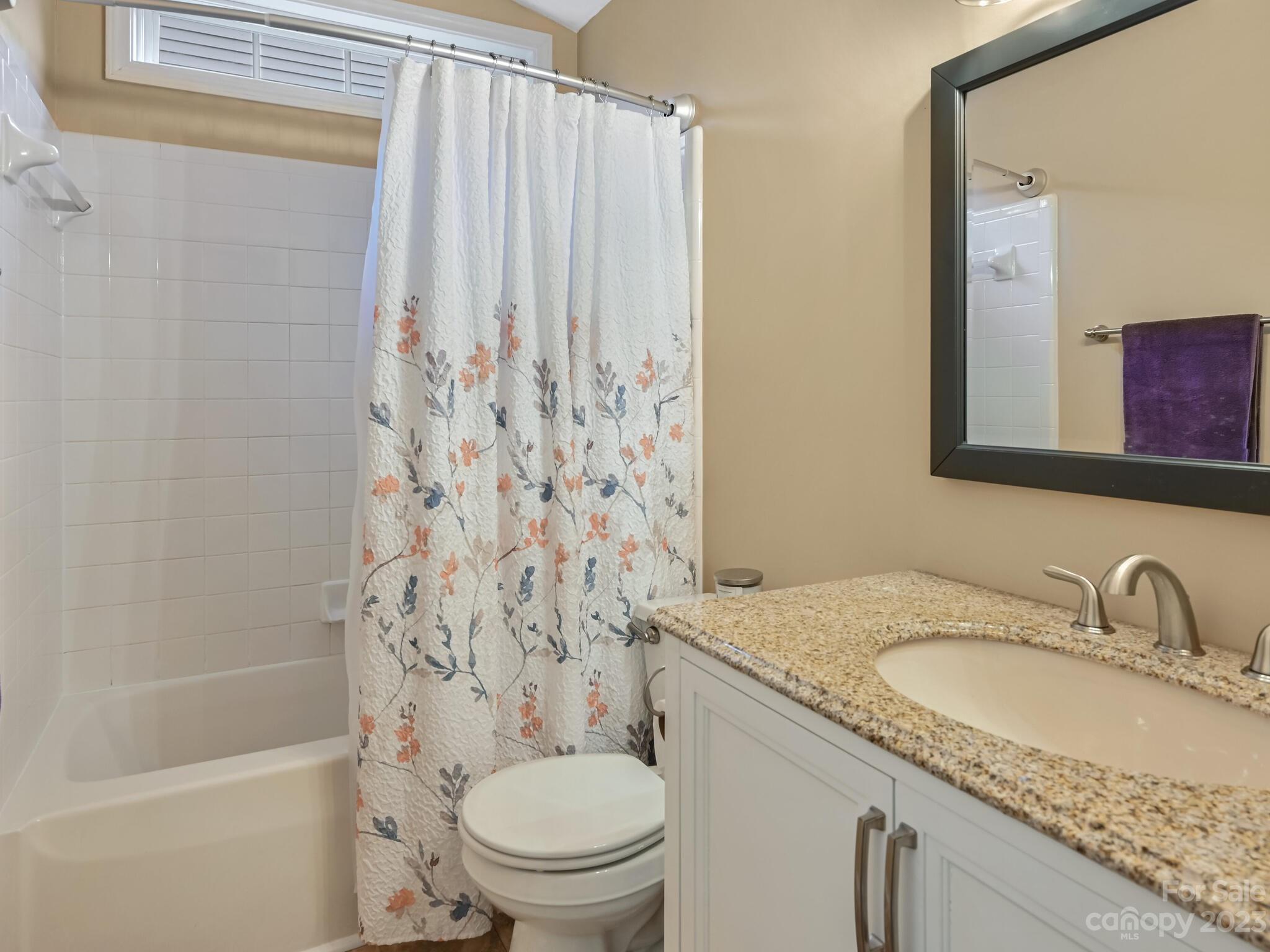 29 Stonehollow Road Fletcher, NC 28732 - Photo 19 of 21 a bathroom with a granite countertop sink toilet and shower