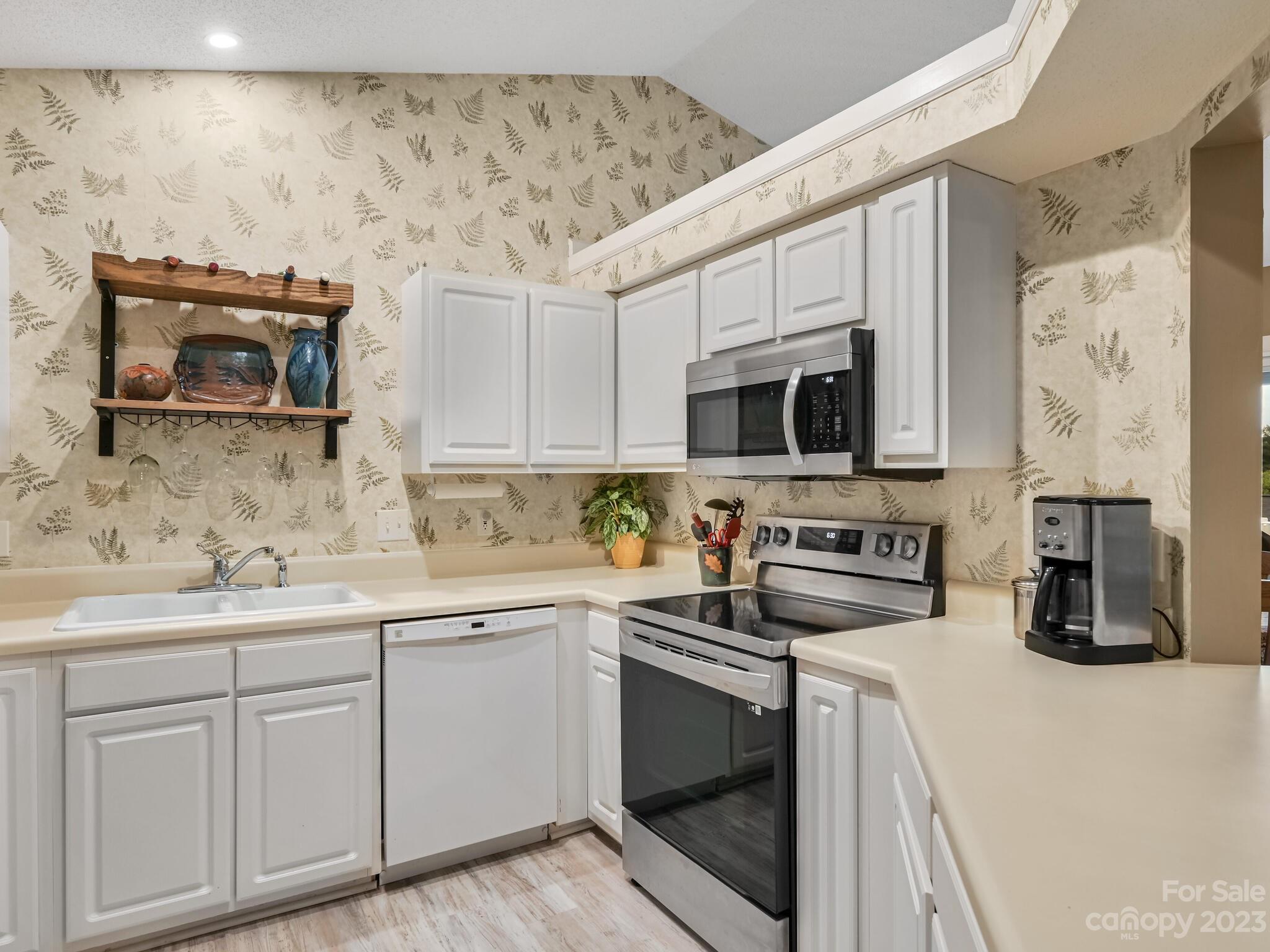29 Stonehollow Road Fletcher, NC 28732 - Photo 8 of 21 a kitchen with stainless steel appliances a stove microwave and sink