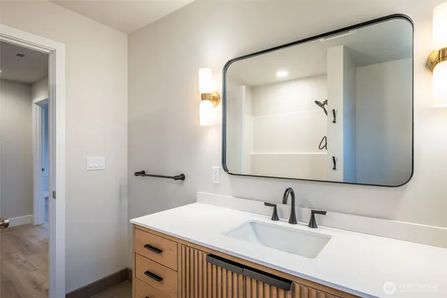 a bathroom with a sink and a mirror