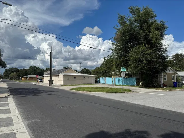 a view of street with tall buildings