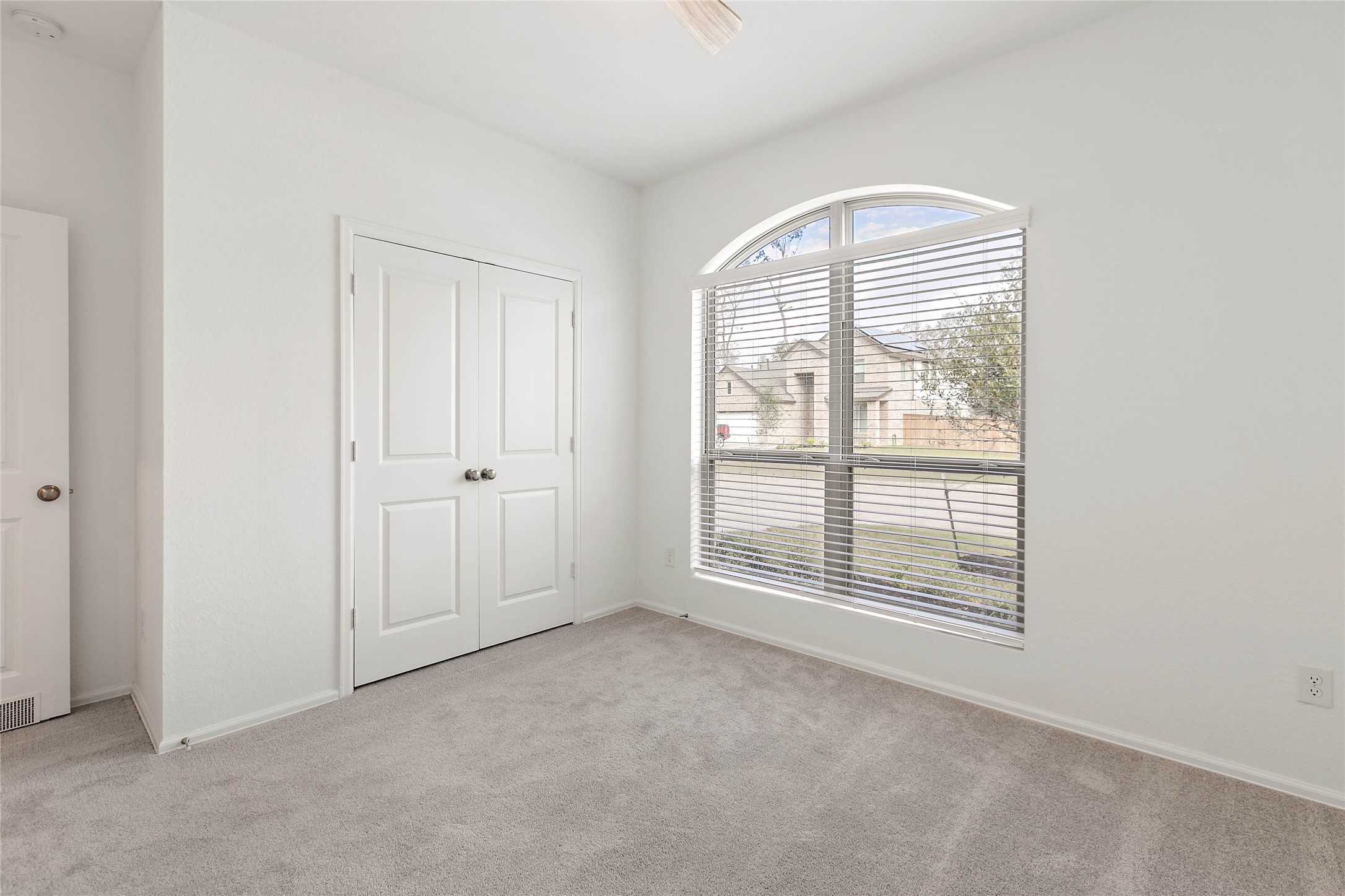 7602 Angels Lndg Lane Porter, TX 77365 - Photo 21 of 32 This secondary bedroom overlooks the quiet street.