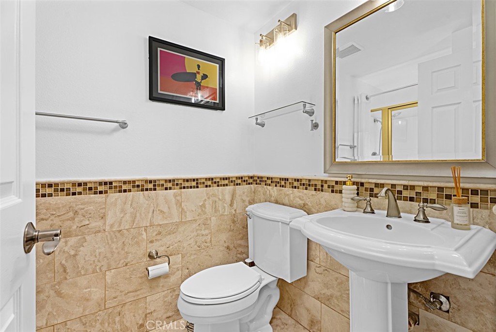 24459 Howes Drive Laguna Niguel, CA 92677 - Photo 13 of 33 a bathroom with a sink and a mirror