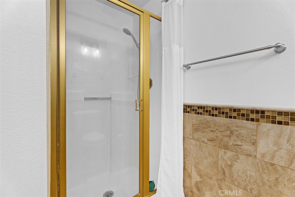 24459 Howes Drive Laguna Niguel, CA 92677 - Photo 14 of 33 a bathroom with a shower and a mirror