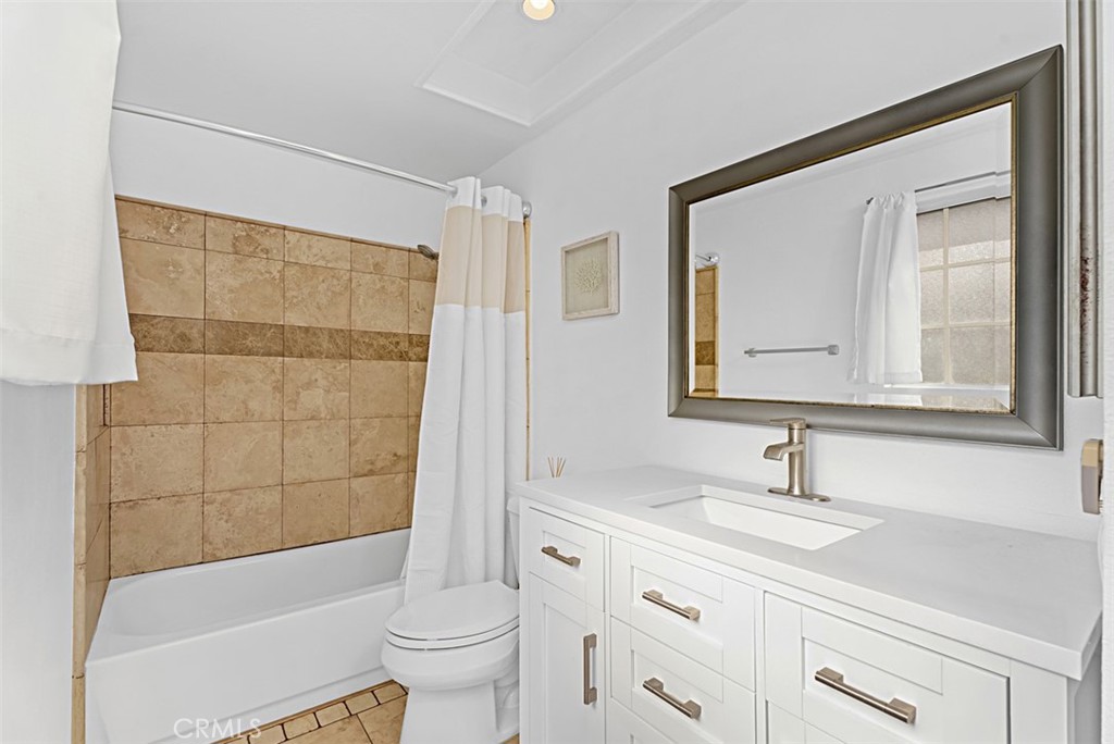 24459 Howes Drive Laguna Niguel, CA 92677 - Photo 17 of 33 a bathroom with a sink a toilet and a bathtub