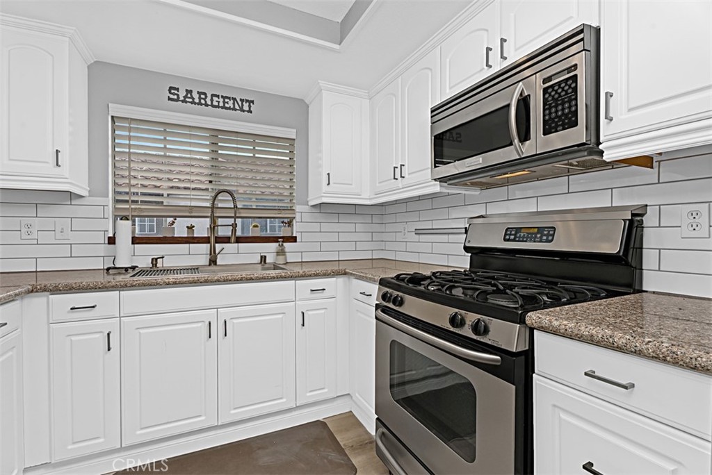 24459 Howes Drive Laguna Niguel, CA 92677 - Photo 2 of 33 a kitchen with granite countertop cabinets stainless steel appliances and a sink