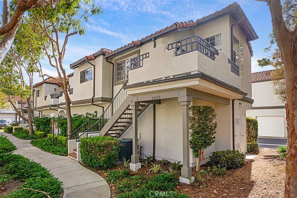 24459 Howes Drive Laguna Niguel, CA 92677 - Photo 22 of 33 front view of a house with a small yard