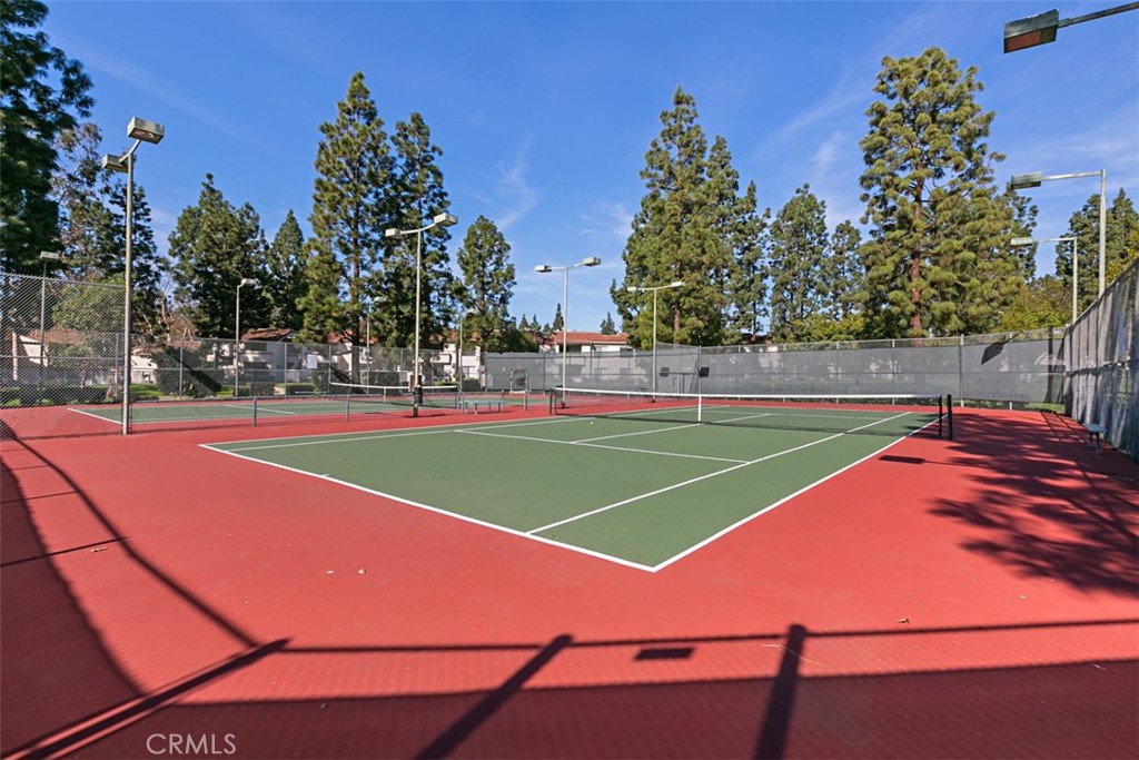 24459 Howes Drive Laguna Niguel, CA 92677 - Photo 24 of 33 a tennis court with trees in the background