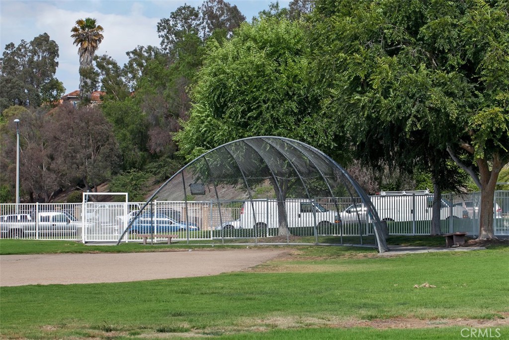 24459 Howes Drive Laguna Niguel, CA 92677 - Photo 30 of 33 a view of a swimming pool with a garden
