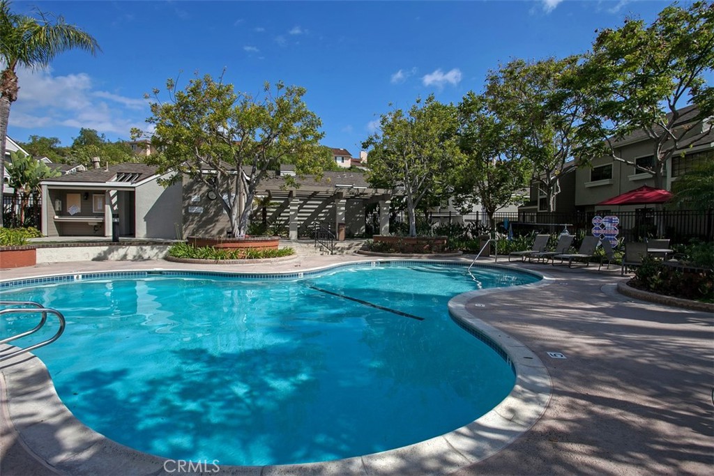 24459 Howes Drive Laguna Niguel, CA 92677 - Photo 31 of 33 a view of a swimming pool with a yard