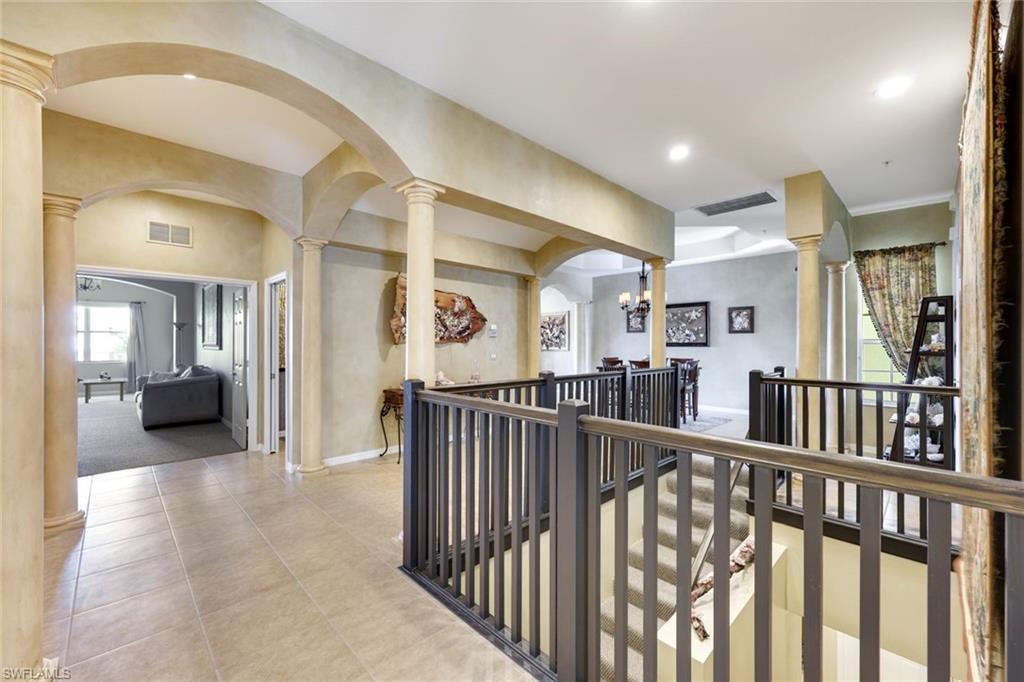3530 Lansing Loop, Unit 202 Estero, FL 33928 - Photo 13 of 35 a view of a hallway with livingroom and furniture