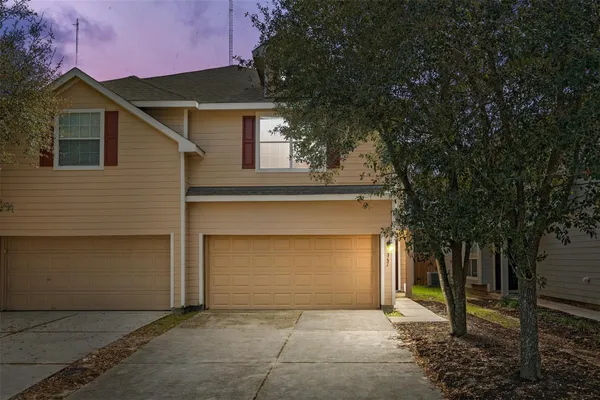 a front view of a house with a garage
