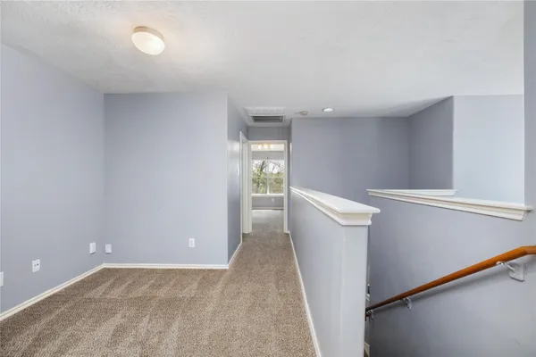 a view of a hallway with an empty room