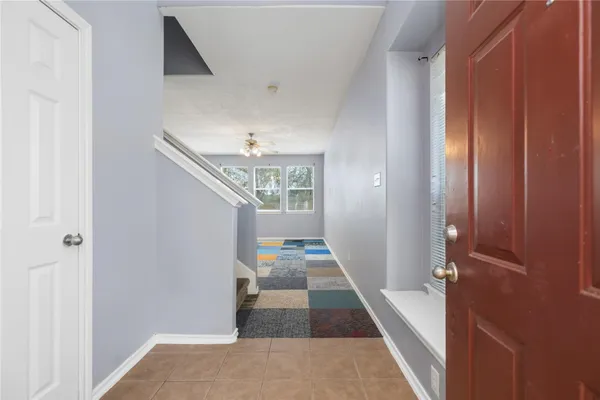 a view of a hallway view with wooden floor and staircase