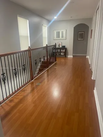 a view of a livingroom with furniture and stairs