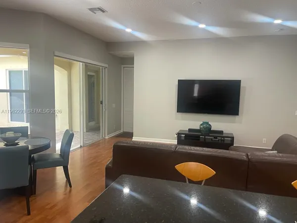 a living room with furniture and a flat screen tv