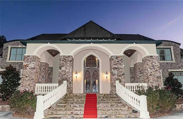 a front view of a house with garden