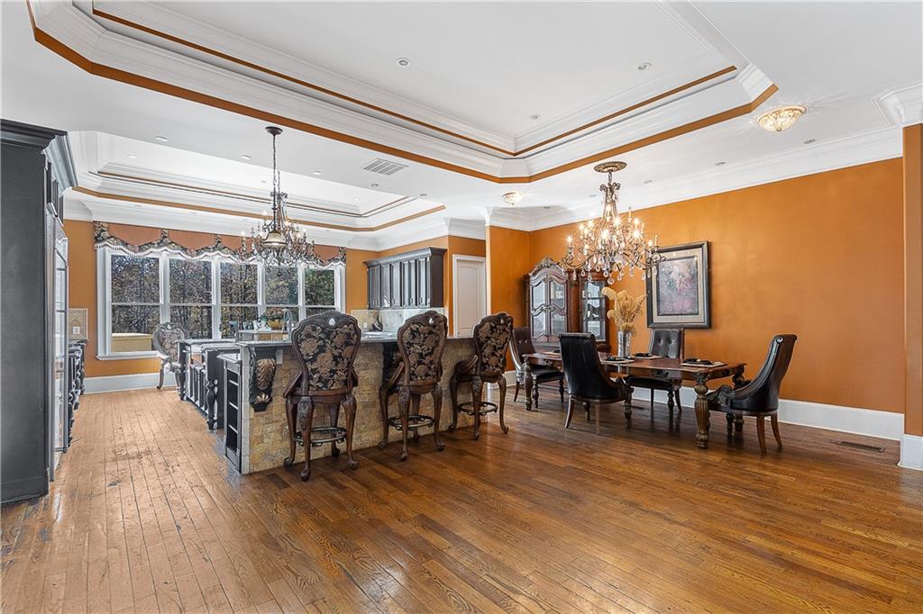 9830 Cedar Grove Road Fairburn, GA 30213 - Photo 11 of 55 a view of a dining room with furniture window and wooden floor