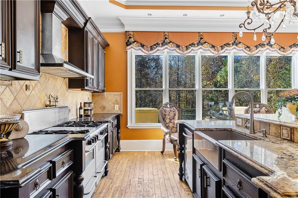 9830 Cedar Grove Road Fairburn, GA 30213 - Photo 12 of 55 a kitchen with furniture a stove and a sink