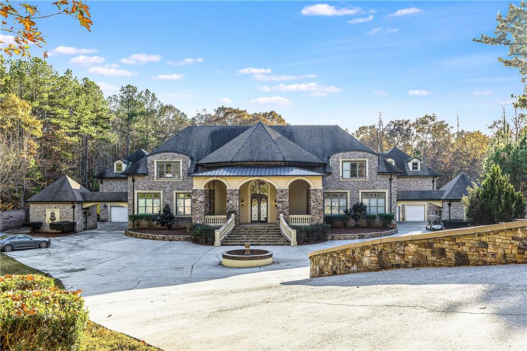 9830 Cedar Grove Road Fairburn, GA 30213 - Photo 2 of 55 a front view of a house with a porch