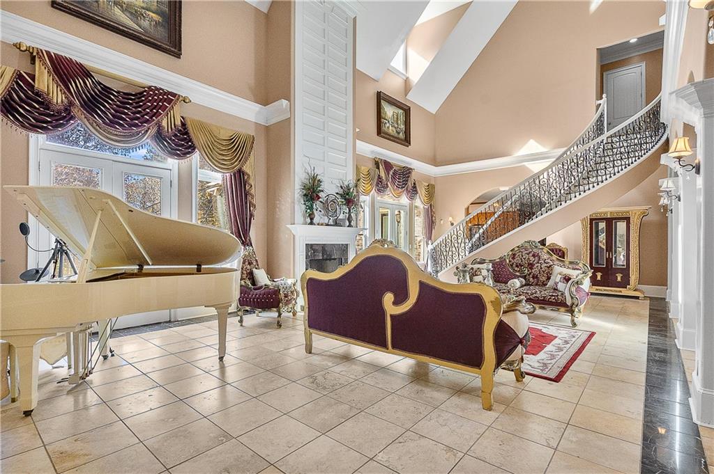9830 Cedar Grove Road Fairburn, GA 30213 - Photo 22 of 55 a living room with furniture and a rug