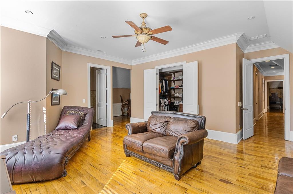 9830 Cedar Grove Road Fairburn, GA 30213 - Photo 28 of 55 a living room with furniture and ceiling fan