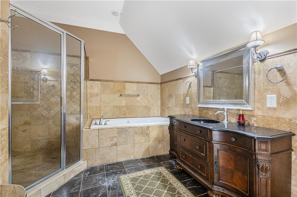 9830 Cedar Grove Road Fairburn, GA 30213 - Photo 30 of 55 a bathroom with a double vanity sink mirror and shower