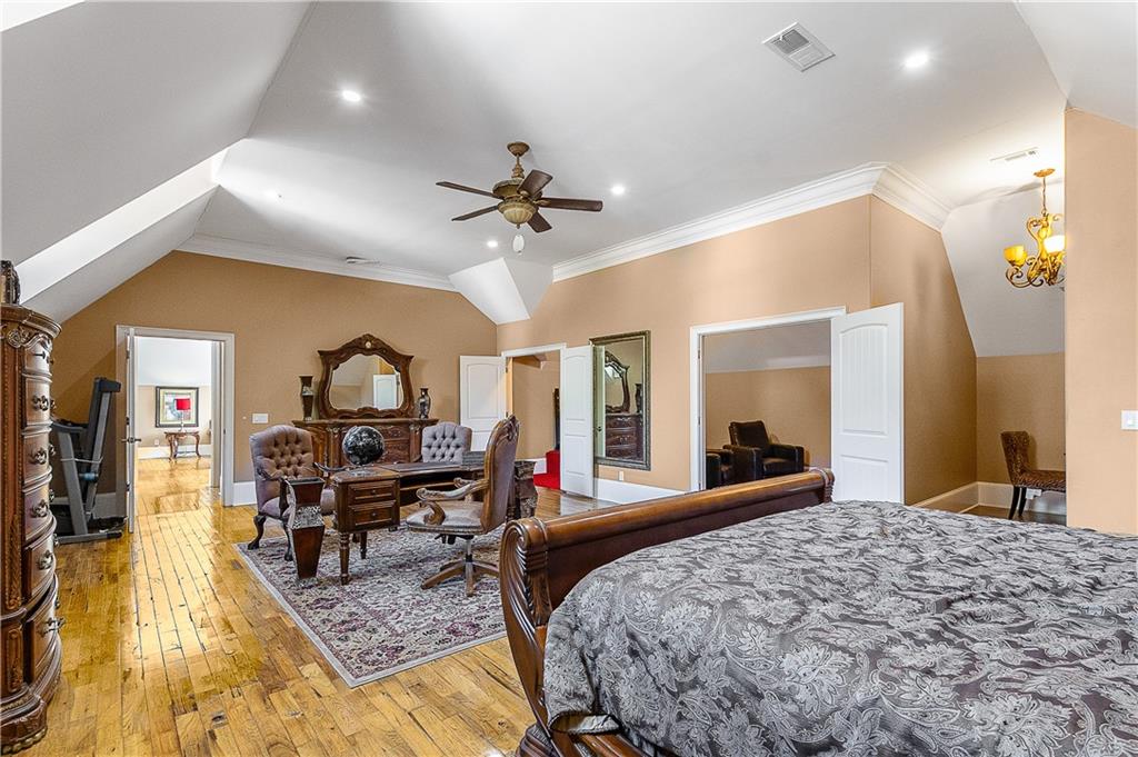 9830 Cedar Grove Road Fairburn, GA 30213 - Photo 31 of 55 a living room with furniture and a wooden floor