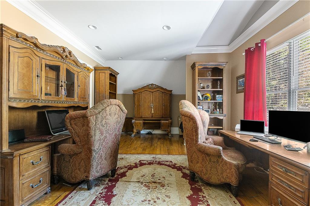 9830 Cedar Grove Road Fairburn, GA 30213 - Photo 32 of 55 a living room with furniture and a flat screen tv