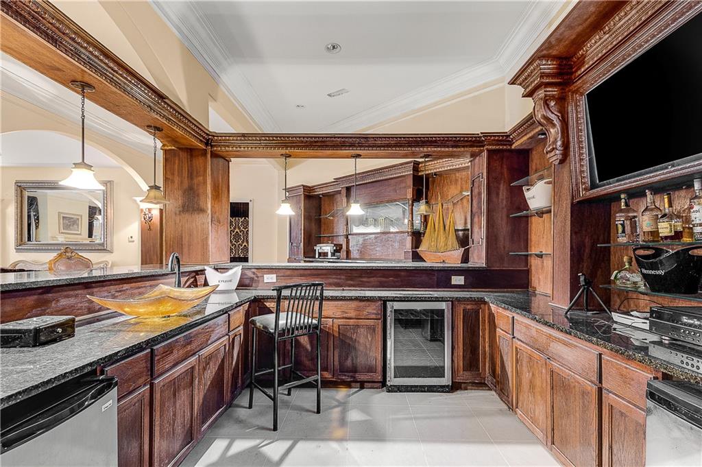 9830 Cedar Grove Road Fairburn, GA 30213 - Photo 48 of 55 a kitchen with a stove a sink and a refrigerator
