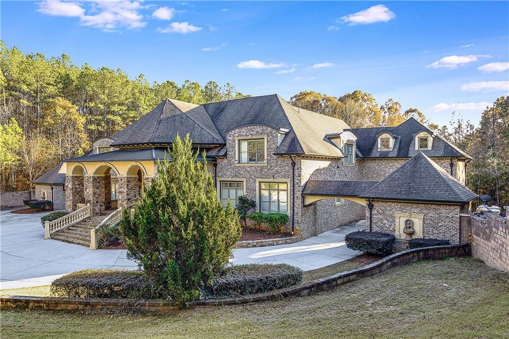 9830 Cedar Grove Road Fairburn, GA 30213 - Photo 5 of 55 a front view of a house with a yard