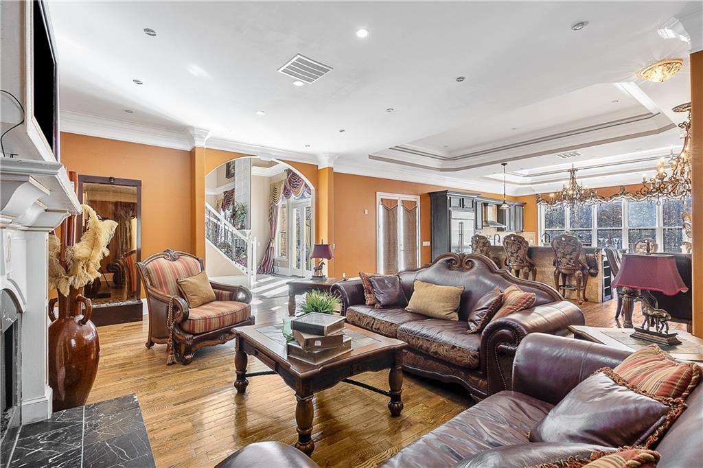 9830 Cedar Grove Road Fairburn, GA 30213 - Photo 9 of 55 a living room with furniture a rug and a large window