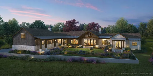 a front view of a house with a yard and outdoor seating