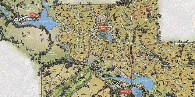 an aerial view of multiple houses with a yard