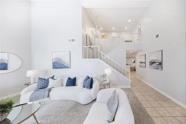 a living room with furniture and white walls