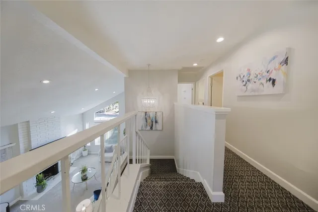 a bedroom with a bed and glass window
