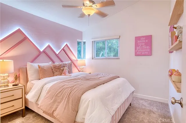 a bed room with a bed and a chandelier