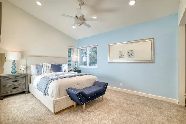 a view of a patio with a table chairs and a backyard