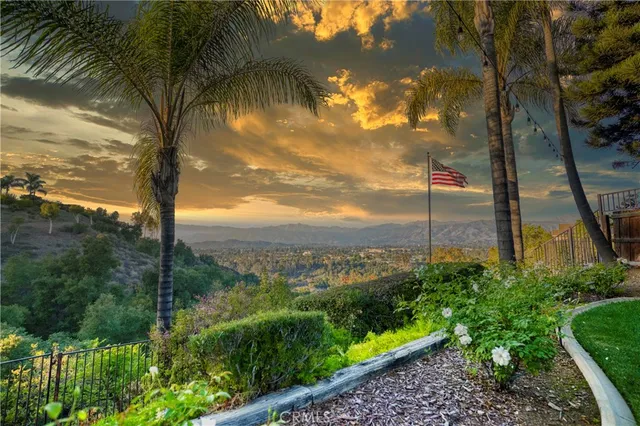 a view of a house with a backyard porch and sitting area