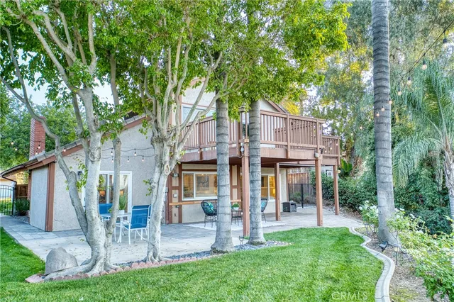 a view of a chair and table in the garden